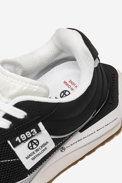 Delta Label Black — construction detail close-up